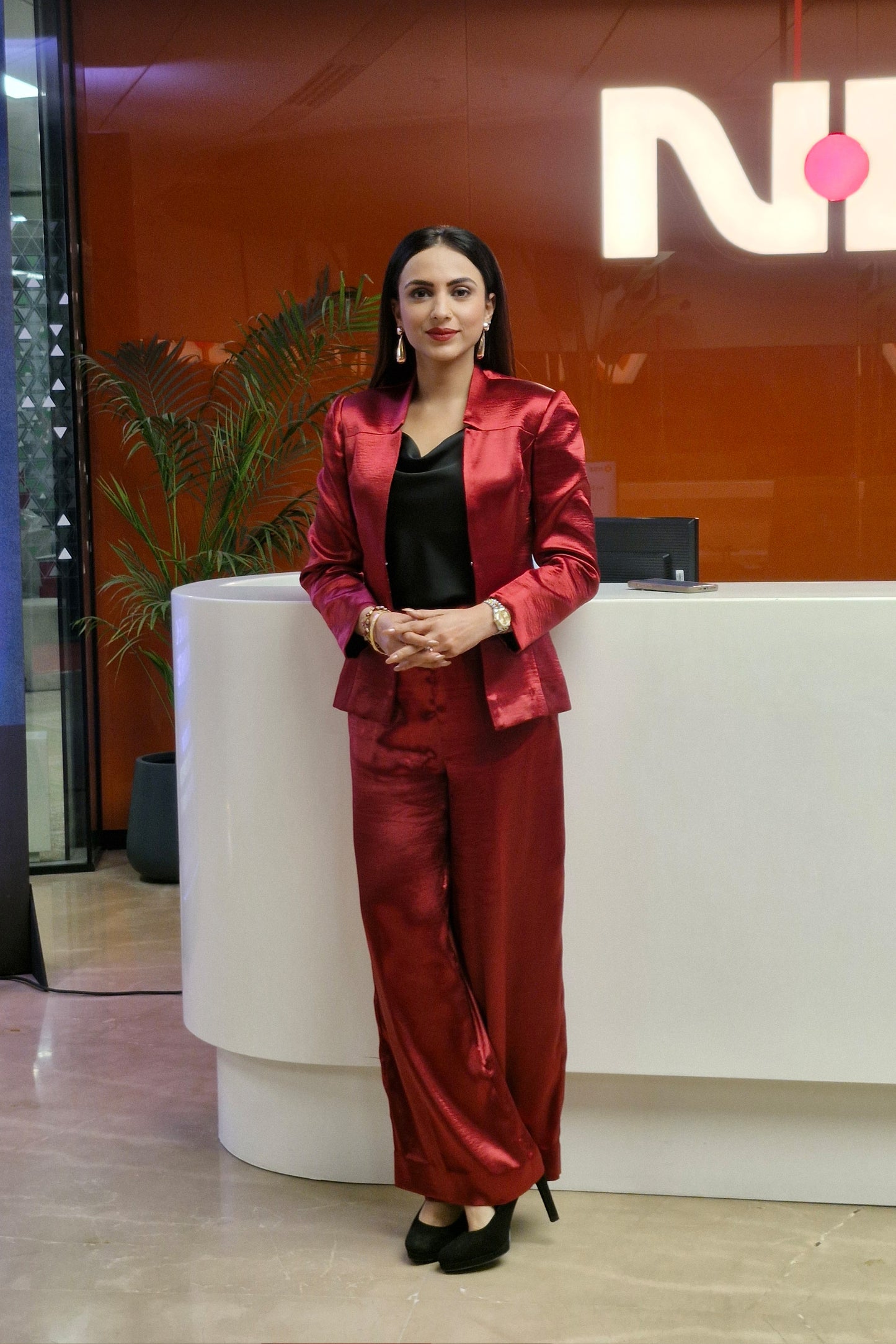 Malika Malhotra in Crimson Split Blazer and Flare Pants