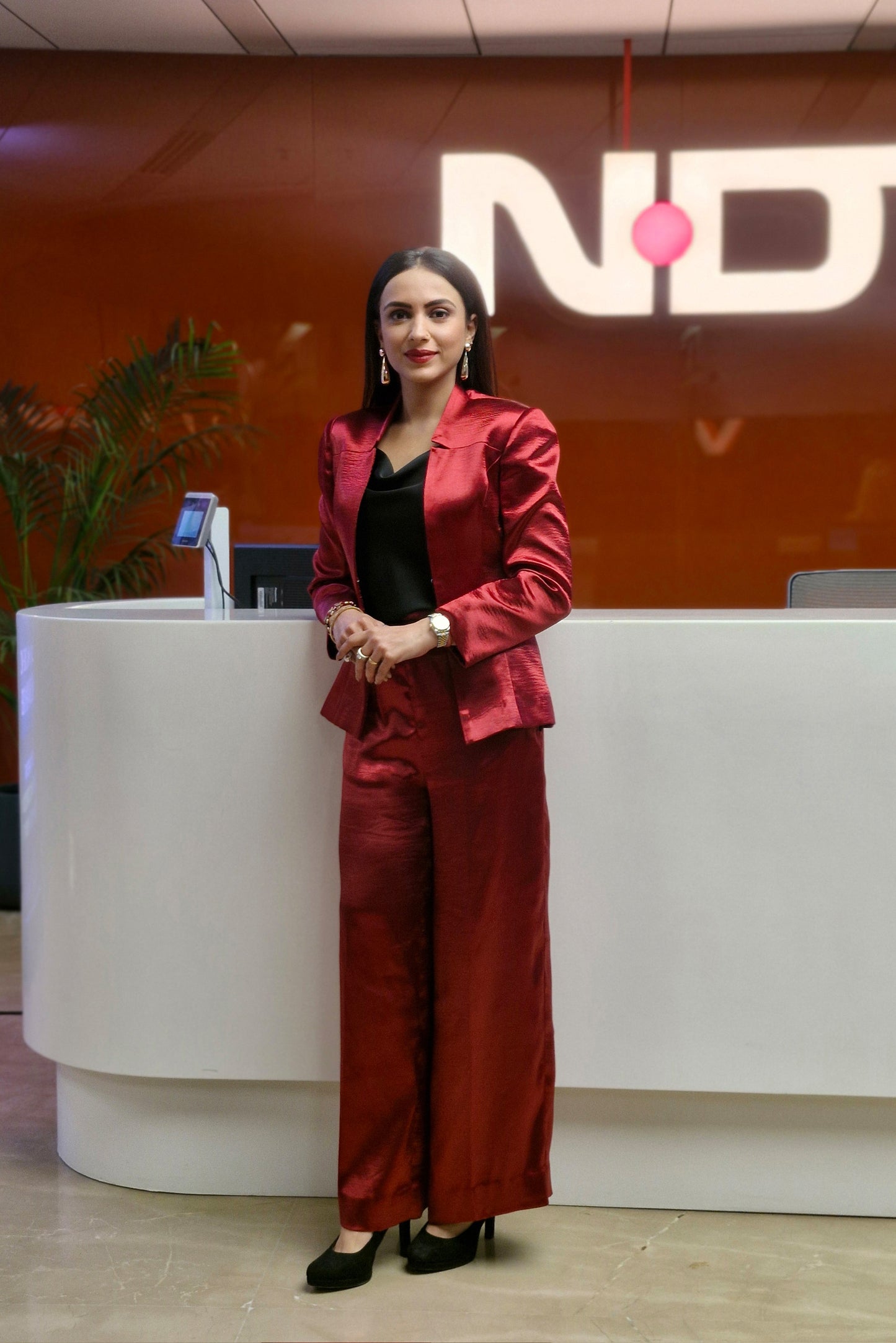 Malika Malhotra in Crimson Split Blazer and Flare Pants